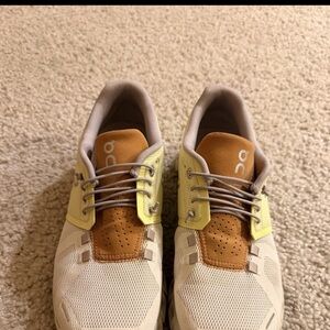 On Running Cream and Tan Sneakers